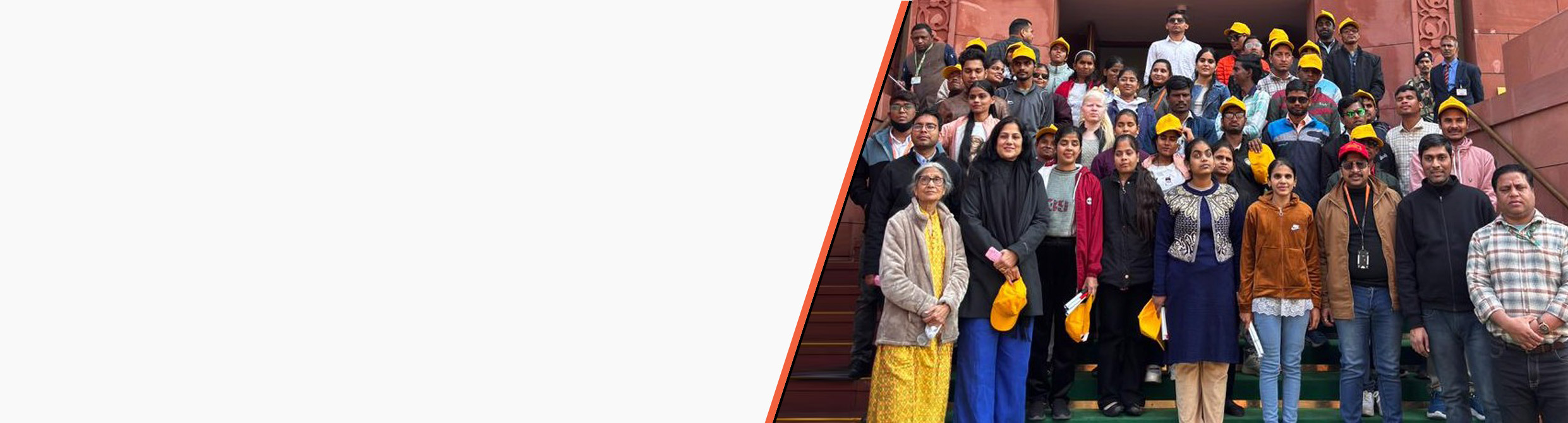 HTBF staff, volunteers, and visually impaired students from Delhi stand together for a group photo during an exposure visit.